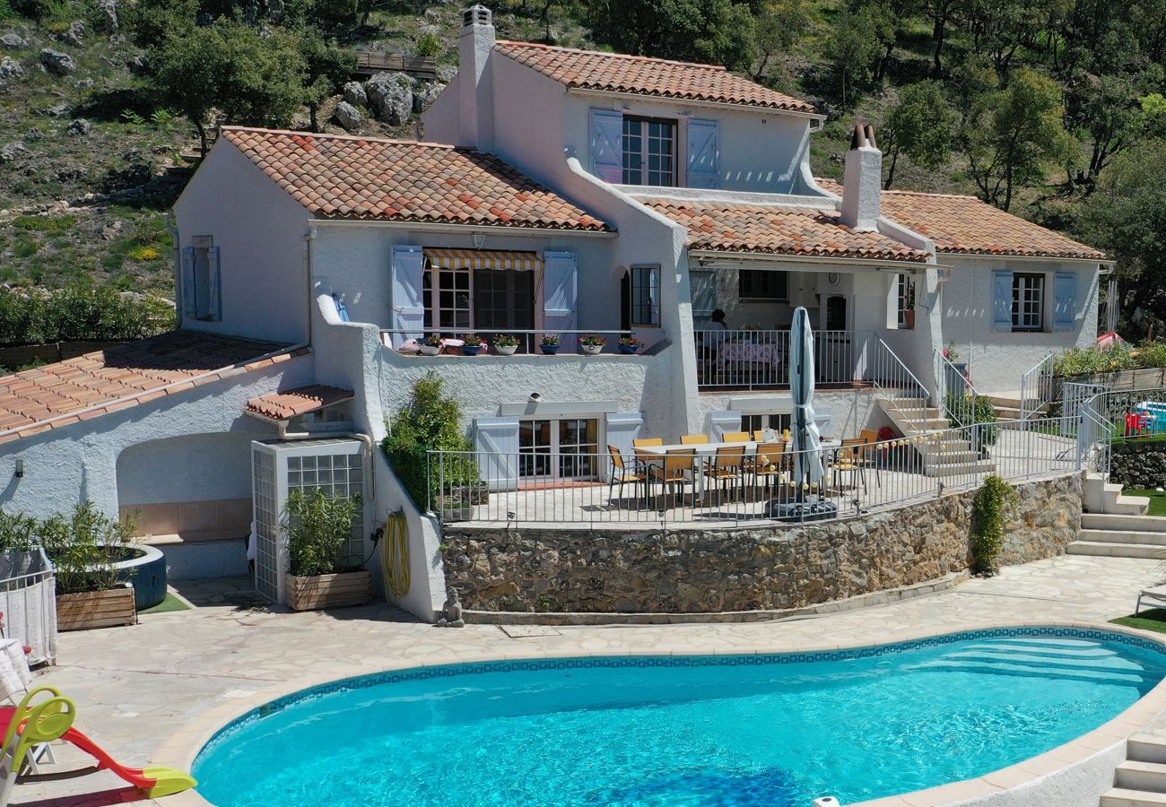 Aerial photo of lavish vacation villa with expansive pool and inviting terraces