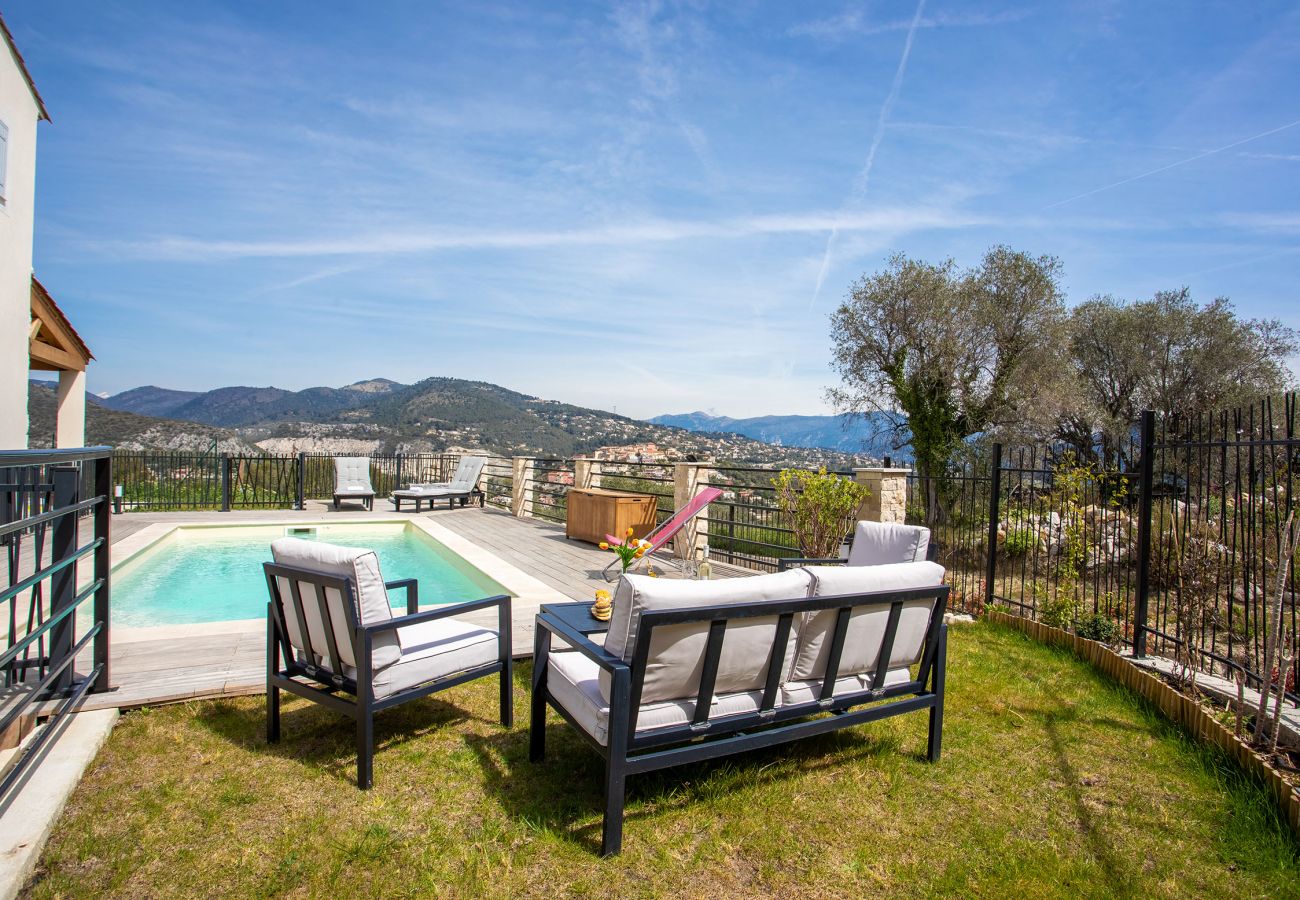 the swimming pool with a view of the hills